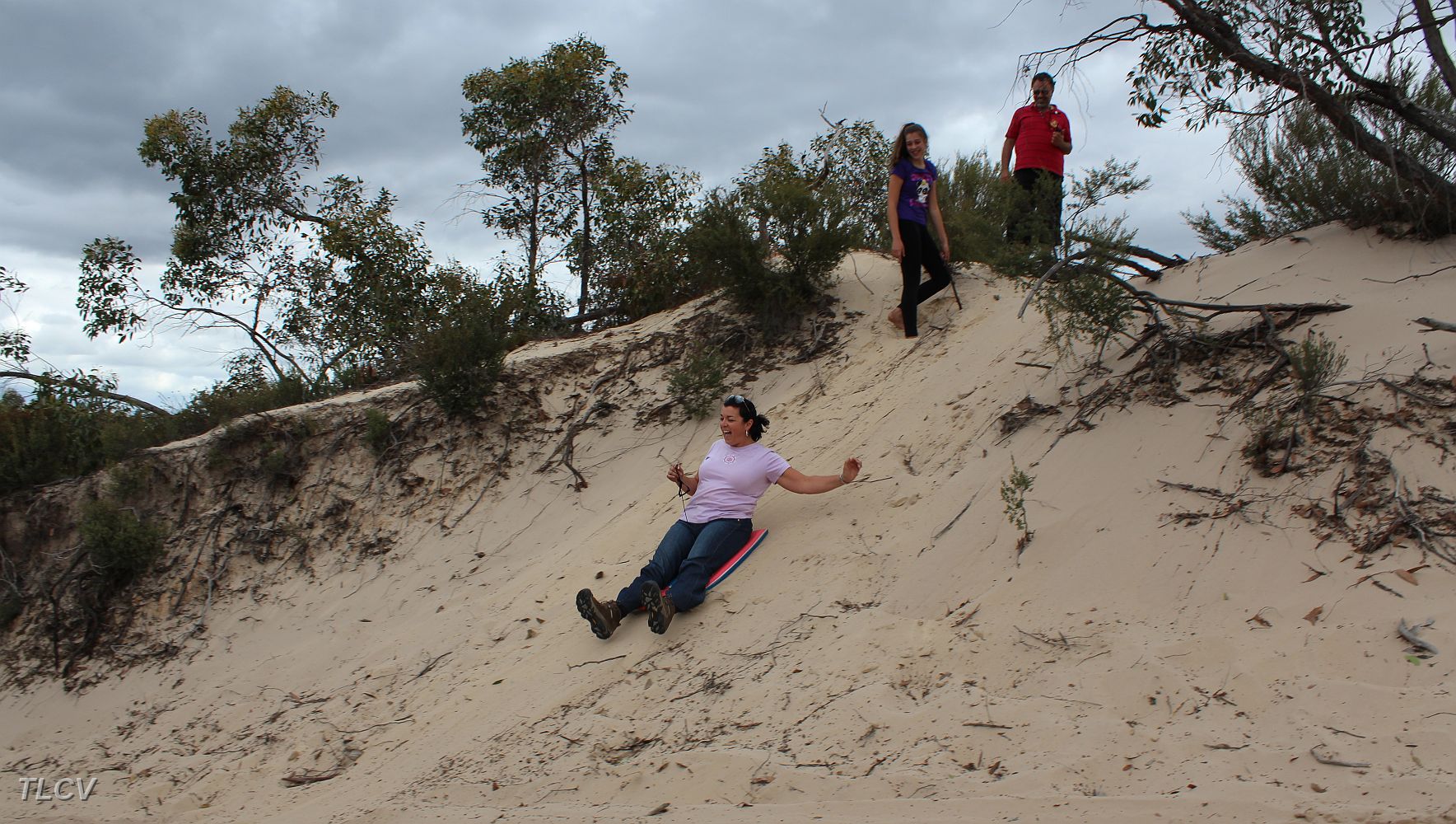 28-Ebony & John watch Joanna slide down a Border track dune.JPG